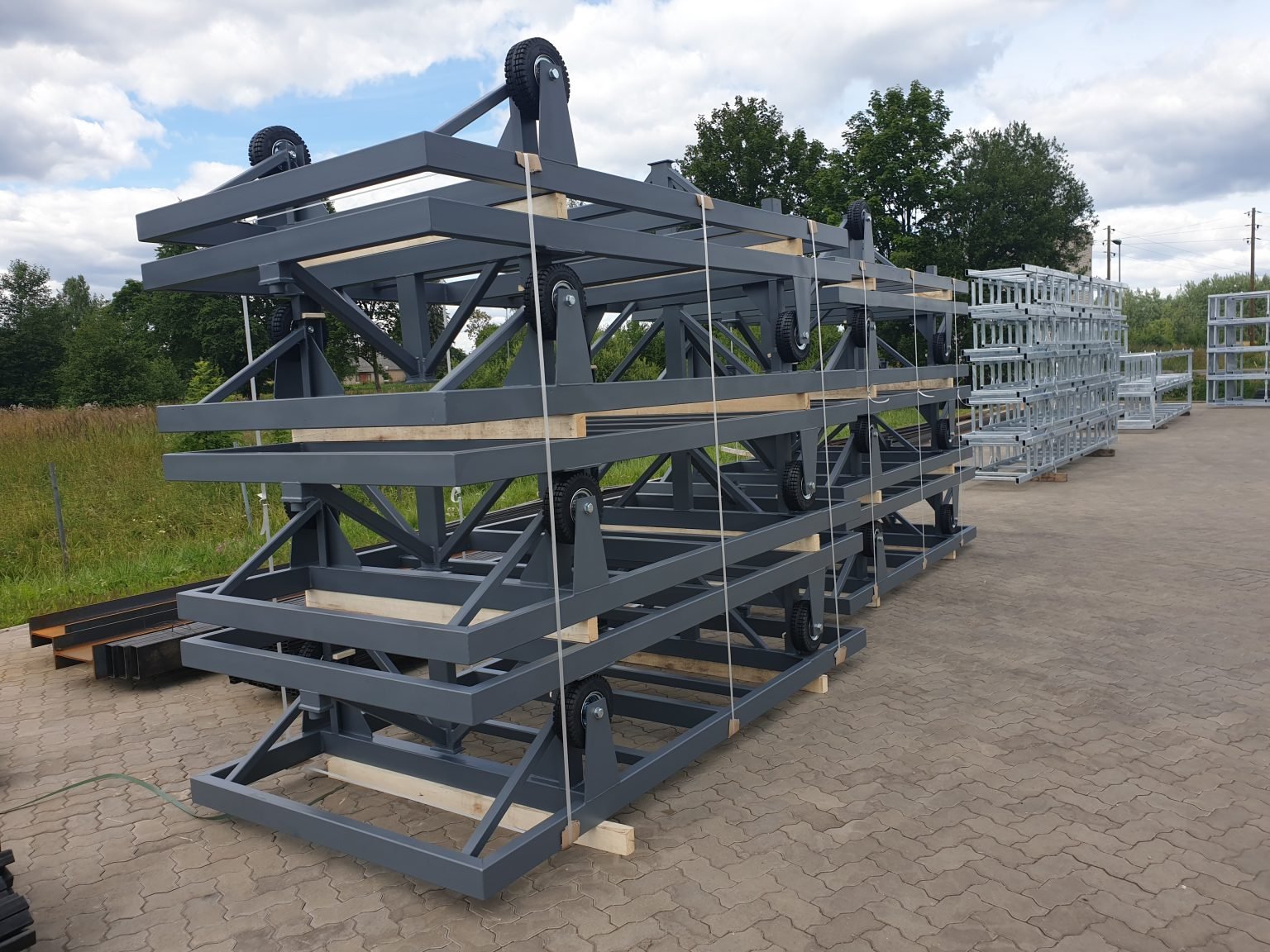 Freshly manufactured and painted steel fabrications prepared for industrial transport and handling