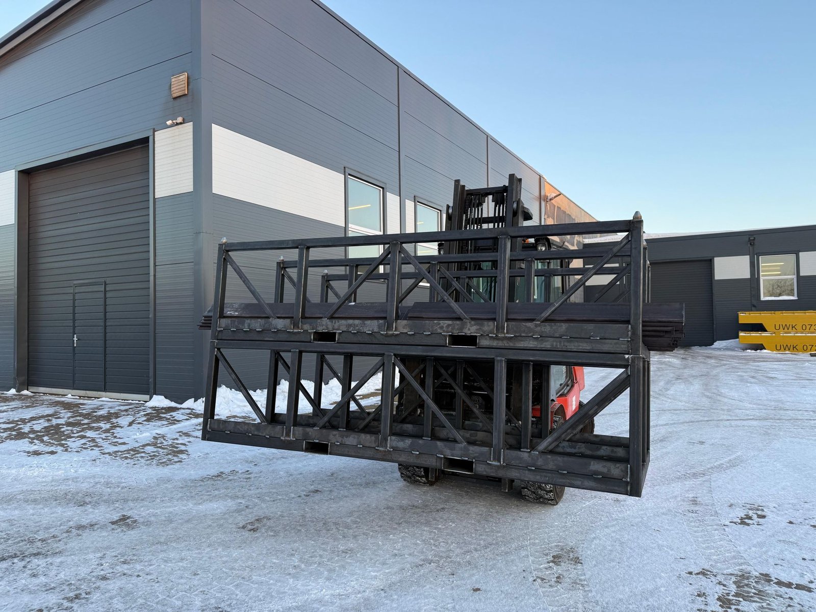 Custom steel stillage handled by forklift before final finishing